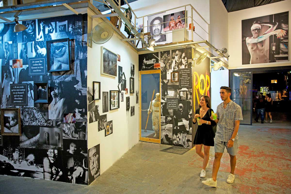 couple walking inside an art exhibition venue