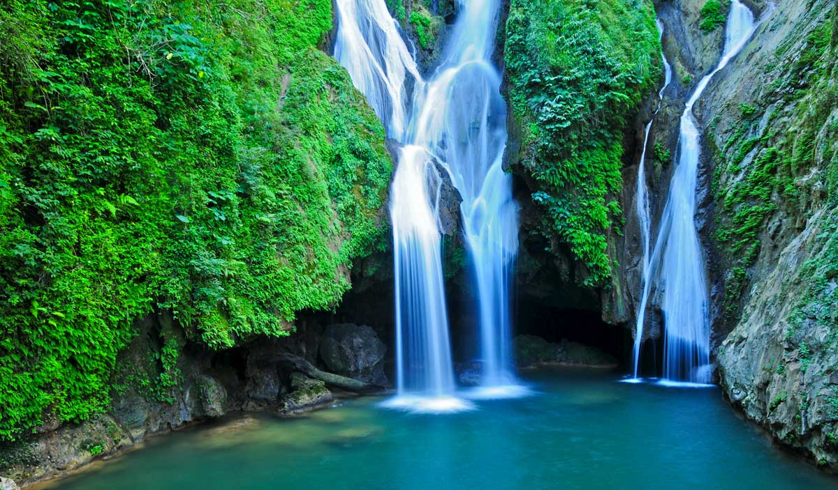 waterfall and natural pond within mountain